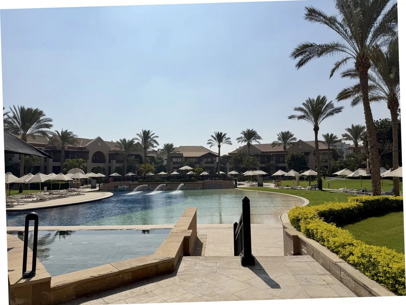 Swimming pool and palms at Katameya Dunes, New Cairo