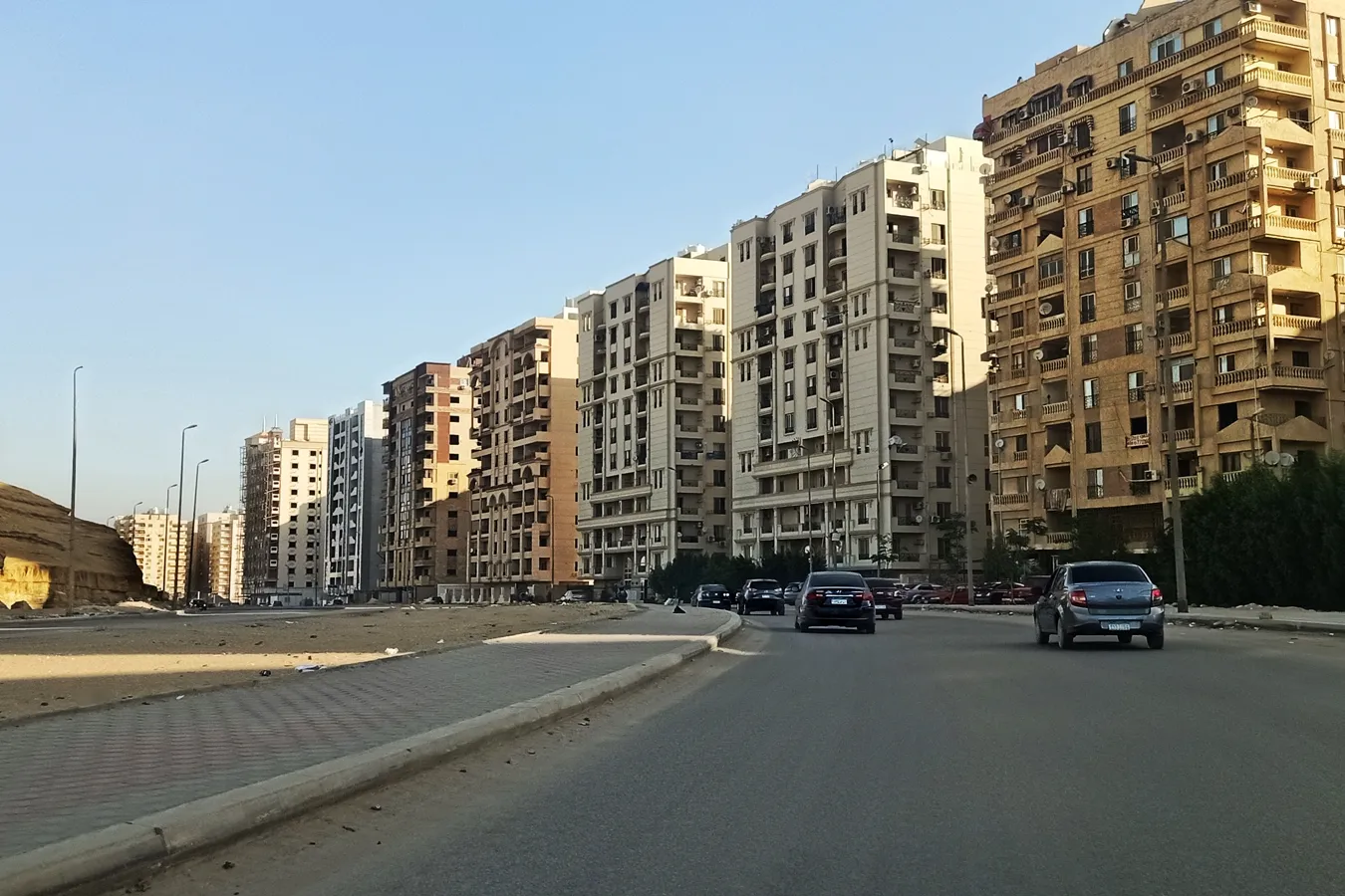 Apartment towers along a wide road in Zahraa Al Maadi, Cairo